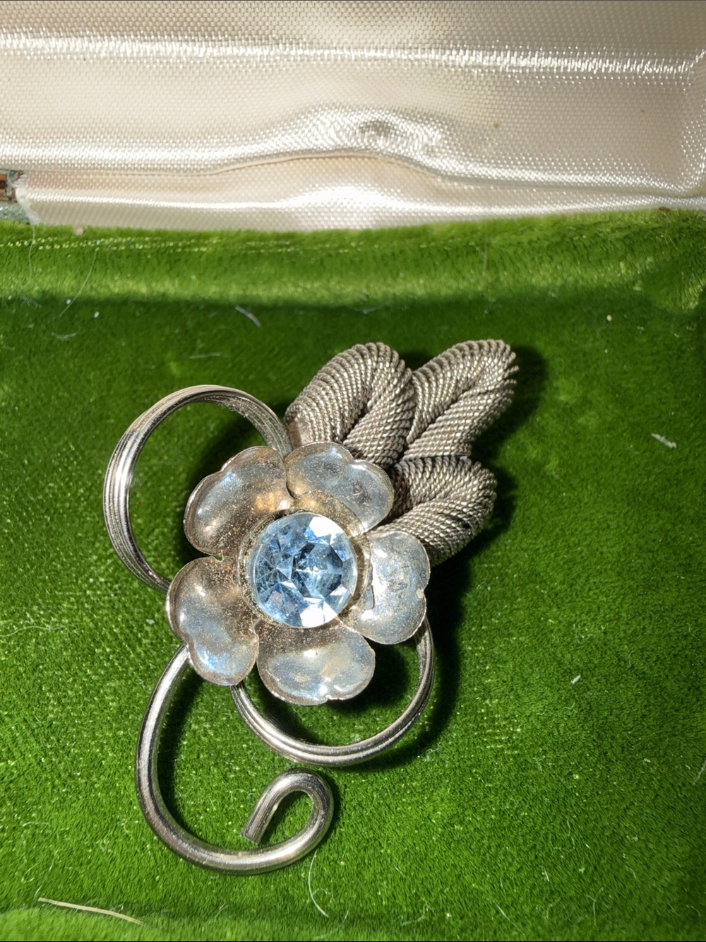 Silver Floral Brooch with Blue Crystal Center
